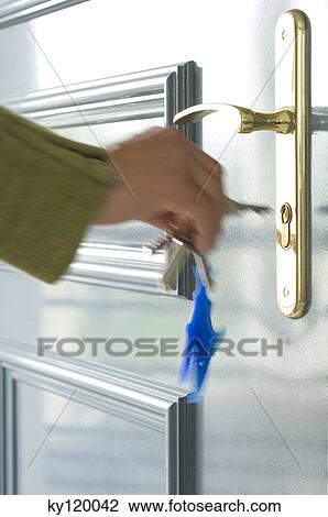 Woman locking the door, close-up View Large Photo Image Stock Image - Woman locking the door, close-up. Fotosearch