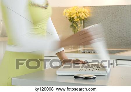 Woman opening a laptop, close-up View Large Photo Image Stock Photo - Woman opening a laptop, close-up. Fotosearch