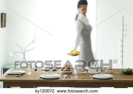 Woman setting the table View Large Photo Image Stock Image - Woman setting the table. Fotosearch