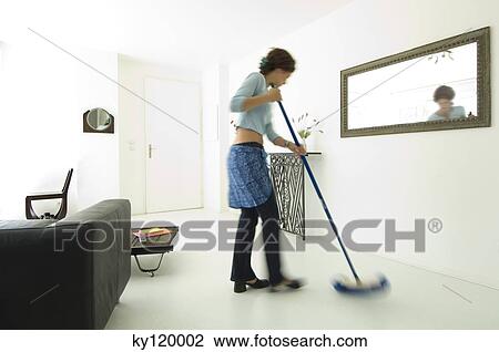 Woman sweeping living-room floor View Large Photo Image Stock Image - Woman sweeping living-room floor. Fotosearch