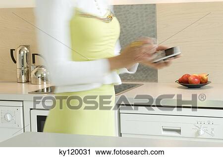 Woman with a mobile phone, close-up View Large Photo Image Stock Image - Woman with a mobile phone, close-up. Fotosearch