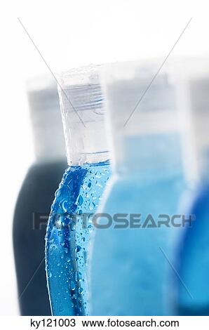 Stock Image - Bottles with waterdrops, close-up. Fotosearch