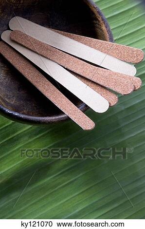 Stock Image - Nail files in a small dish, close-up. Fotosearch