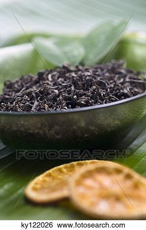 Dried green tea leaves, close-up View Large Photo Image Stock Photograph - Dried green tea leaves, close-up. Fotosearch