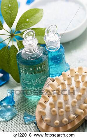 Essential oil bottles and massage brush, close-up View Large Photo Image Stock Photo - Essential oil bottles and massage brush, close-up. Fotosearch
