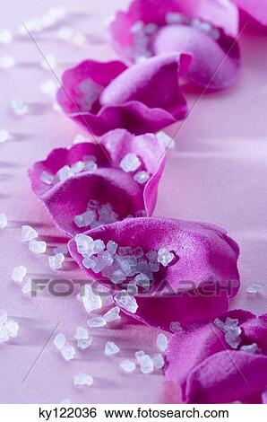Stock Photograph - Flowers petals and bath salts, close-up. Fotosearch
