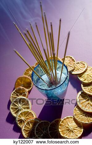 Insense sticks and dried orange slices, close-up View Large Photo Image Stock Photo - Insense sticks and dried orange slices, close-up. Fotosearch