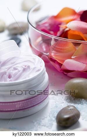 Moisturizer and flower petals, close-up View Large Photo Image Stock Image - Moisturizer and flower petals, close-up. Fotosearch
