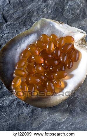 Omega 3 capsules, close-up View Large Photo Image Stock Photo - Omega 3 capsules, close-up. Fotosearch