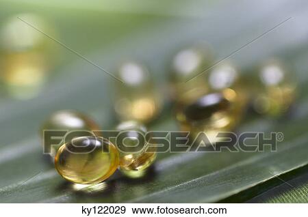 Omega 3 capsules, close-up View Large Photo Image Stock Photo - Omega 3 capsules, close-up. Fotosearch