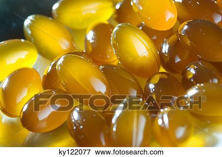 Omega 3 capsules, close-up View Large Photo Image Stock Photo - Omega 3 capsules, close-up. Fotosearch