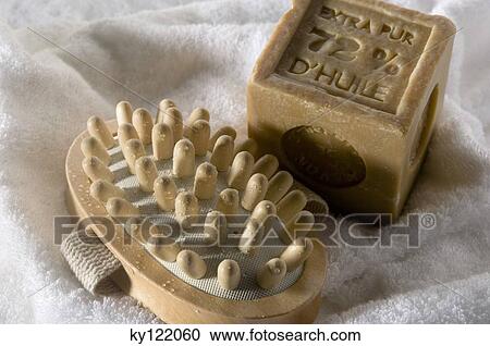 Soap and wooden massager on a towel, close-up View Large Photo Image Stock Image - Soap and wooden massager on a towel, close-up. Fotosearch