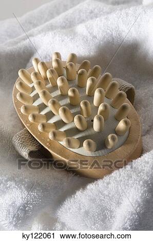Wooden massager on a bath towel, close-up View Large Photo Image Stock Image - Wooden massager on a bath towel, close-up. Fotosearch