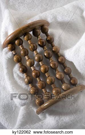 Wooden massager on a bath towel, close-up View Large Photo Image Stock Image - Wooden massager on a bath towel, close-up. Fotosearch