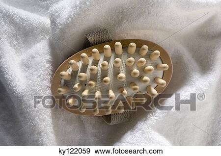 Wooden massager on a bath towel, close-up View Large Photo Image Stock Photo - Wooden massager on a bath towel, close-up. Fotosearch