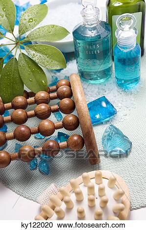 Wooden massagers and essential oil bottles, close-up View Large Photo Image Stock Image - Wooden massagers and essential oil bottles, close-up. Fotosearch