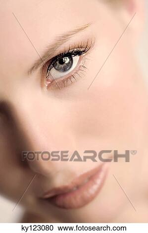 Portrait of a young woman looking at the camera, make-up, close-up, indoors (studio) View Large Photo Image Stock Image - Portrait of a young woman looking at the camera, make-up, close-up, indoors (studio). Fotosearch