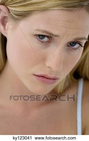 Portrait of young woman frowning View Large Photo Image Stock Image - Portrait of young woman frowning. Fotosearch