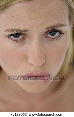 Portrait of young woman frowning View Large Photo Image Stock Image - Portrait of young woman frowning. Fotosearch