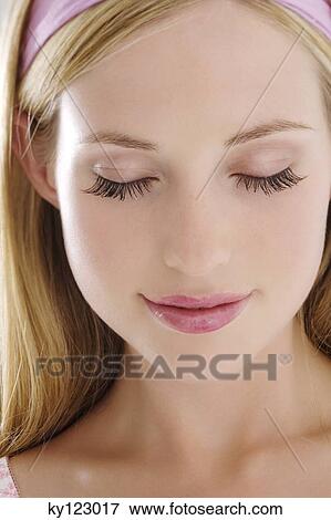 Young woman face with make up, eyes shut, close-up (studio) View Large Photo Image Stock Photo - Young woman face with make up, eyes shut, close-up (studio). Fotosearch
