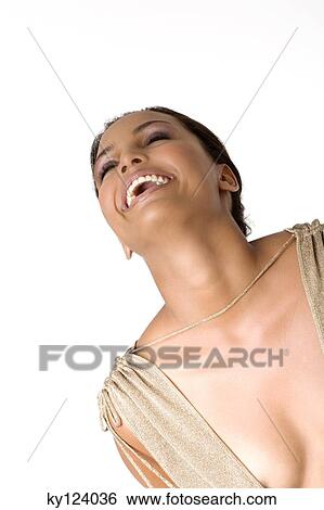 Stock Photograph - Portrait of a young smiling woman in low-cut dress. Fotosearch