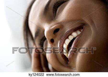 Stock Image - Portrait of a young smiling woman. Fotosearch