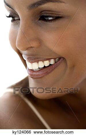 Stock Photograph - Portrait of a young smiling woman. Fotosearch