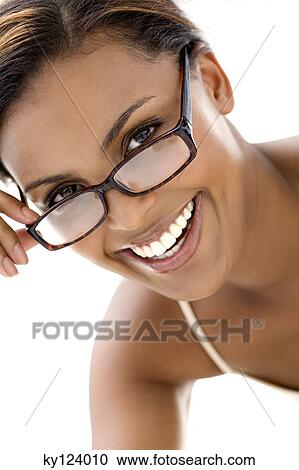 Stock Image - Portrait of a young smiling woman with eyeglasses. Fotosearch
