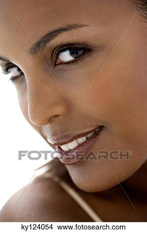 Picture - Portrait of a young woman looking at the camera. Fotosearch
