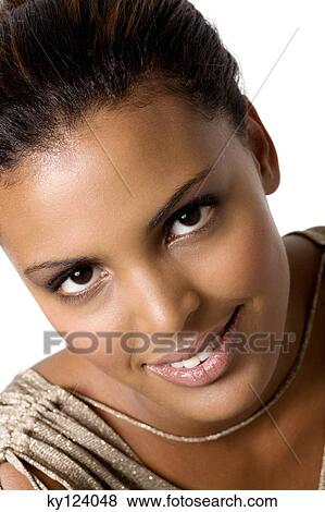 Stock Photo - Portrait of a young woman looking at the camera. Fotosearch