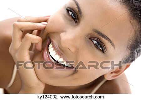 Portrait of a young woman, smiling for the camera View Large Photo Image Stock Image - Portrait of a young woman, smiling for the camera. Fotosearch