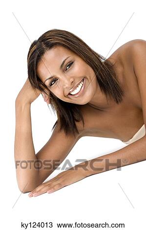 Young smiling woman resting her head on her hand View Large Photo Image Stock Image - Young smiling woman resting her head on her hand. Fotosearch