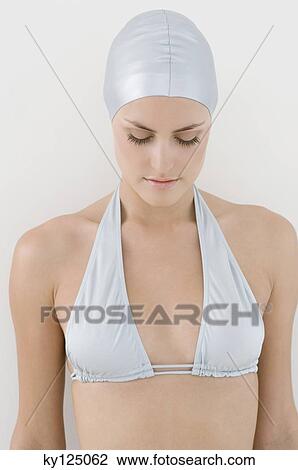 Portrait of a young woman in bikini and swimming cap, eyes closed View Large Photo Image Stock Image - Portrait of a young woman in bikini and swimming cap, eyes closed. Fotosearch