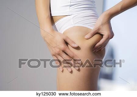 Woman pinching thigh, close-up View Large Photo Image Stock Image - Woman pinching thigh, close-up. Fotosearch