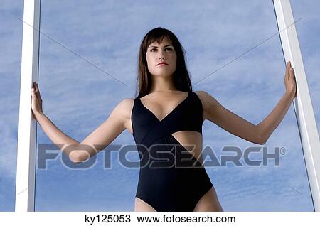 Young woman in black sexy swimming costume View Large Photo Image Stock Image - Young woman in black sexy swimming costume. Fotosearch