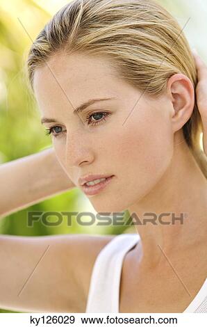 Portrait of a young thoughful woman, outdoors View Large Photo Image Stock Photo - Portrait of a young thoughful woman, outdoors. Fotosearch