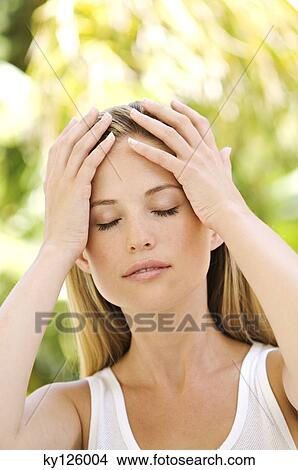 Portrait of a young woman, eyes shut, hands on her head, outdoors View Large Photo Image Picture - Portrait of a young woman, eyes shut, hands on her head, outdoors. Fotosearch