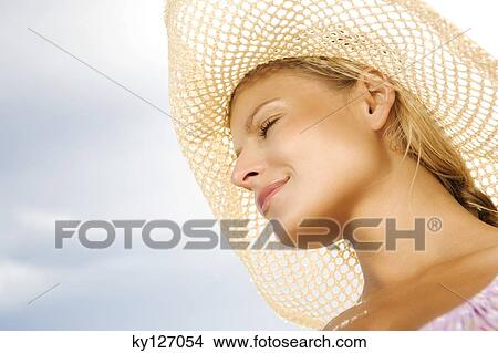 Portrait of a young woman with eyes closed, hat View Large Photo Image Picture - Portrait of a young woman with eyes closed, hat. Fotosearch