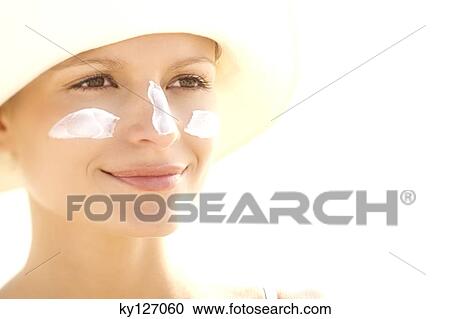 Portrait of a young woman with sun cream on face View Large Photo Image Stock Image - Portrait of a young woman with sun cream on face. Fotosearch