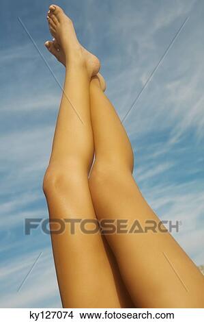 Woman's legs in the air View Large Photo Image Picture - Woman's legs in the air. Fotosearch
