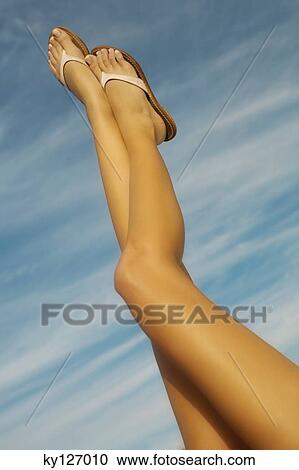 Woman's legs in the air View Large Photo Image Stock Image - Woman's legs in the air. Fotosearch