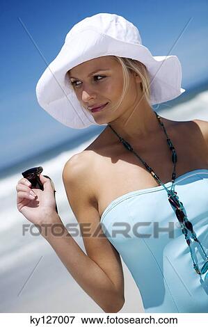 Young woman in swimming costume, hat View Large Photo Image Stock Photo - Young woman in swimming costume, hat. Fotosearch