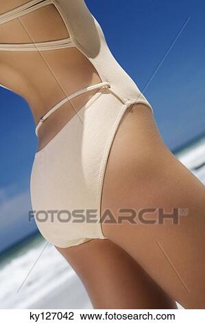 Young woman in swimming costume View Large Photo Image Stock Image - Young woman in swimming costume. Fotosearch