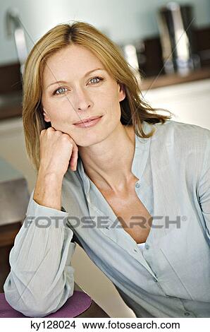 Picture - Portrait of a woman looking at the camera. Fotosearch