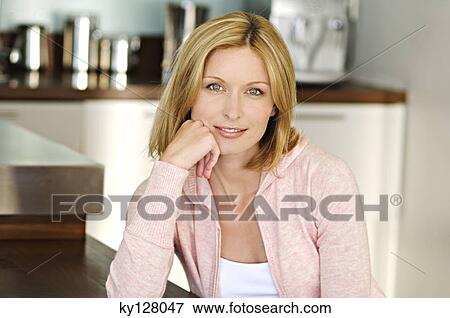 Portrait of a woman looking at the camera View Large Photo Image Stock Photo - Portrait of a woman looking at the camera. Fotosearch