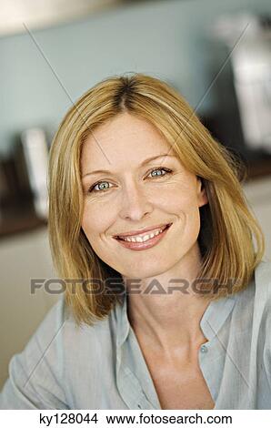 Portrait of a woman smiling for the camera View Large Photo Image Picture - Portrait of a woman smiling for the camera. Fotosearch