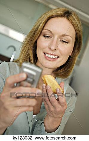 Portrait of a woman using mobile phone View Large Photo Image Stock Image - Portrait of a woman using mobile phone. Fotosearch
