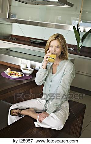 Woman drinking fruit juice View Large Photo Image Stock Photo - Woman drinking fruit juice. Fotosearch