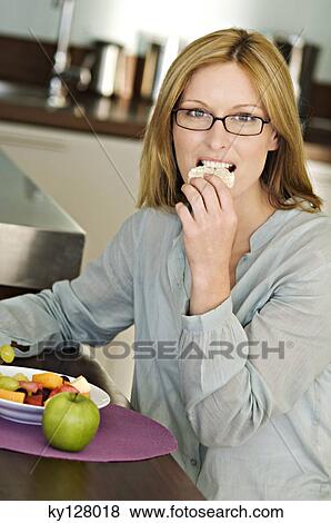 Woman eating rice cake View Large Photo Image Stock Photo - Woman eating rice cake. Fotosearch