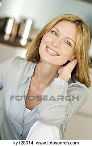 Woman smiling for the camera View Large Photo Image Picture - Woman smiling for the camera. Fotosearch